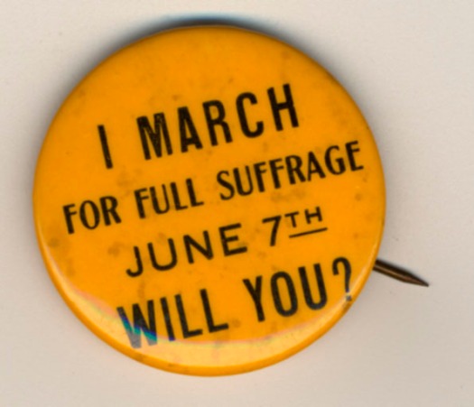 Photograph of a political button reading, "I march for full suffrage June 7th. Will you?" From the SCUA Artifact Collection. Suffragists wore buttons like this for a variety of reasons.  Many to get people to know that suffrage was on the ballot or to proudly show that they were a suffragist.