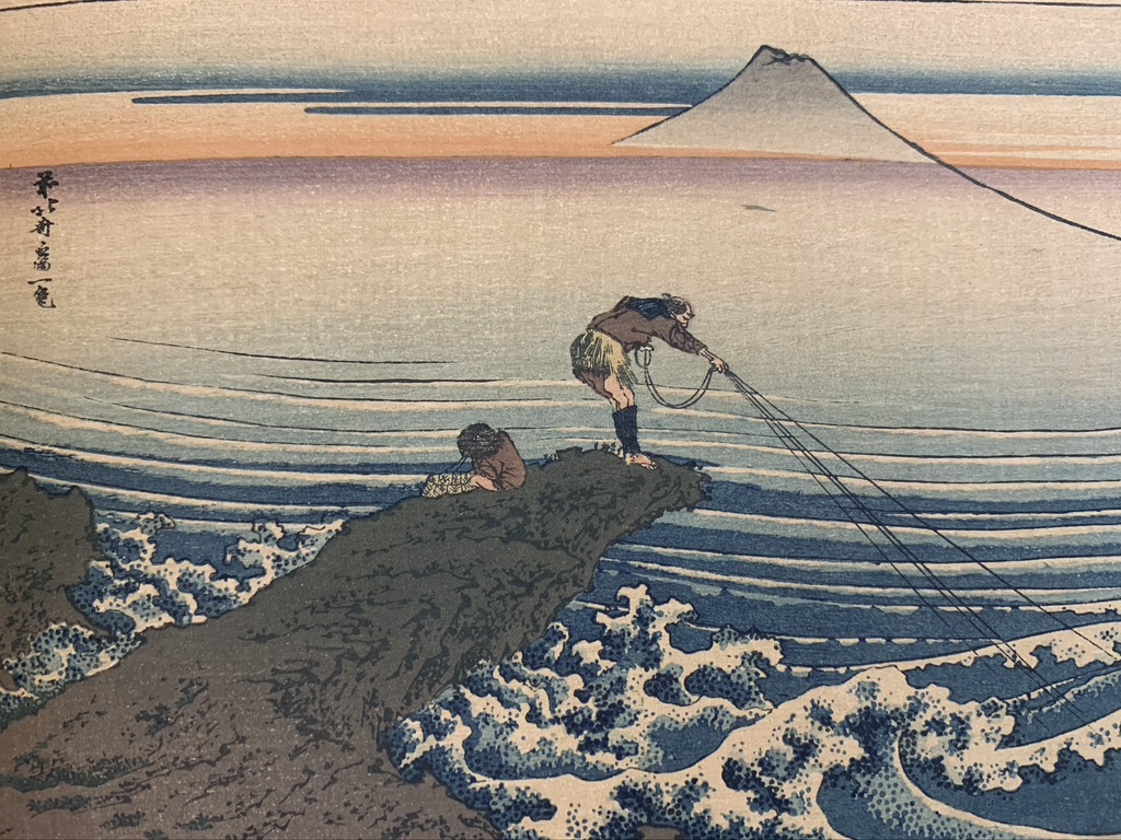 Hokusai painting of fisherman with Mt. Fuji bathed by an orange/purple glow.